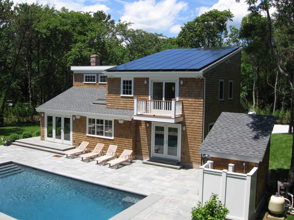 A photo of an eco-friendly residential solar panel installation setup by Sun Up Zero Down
