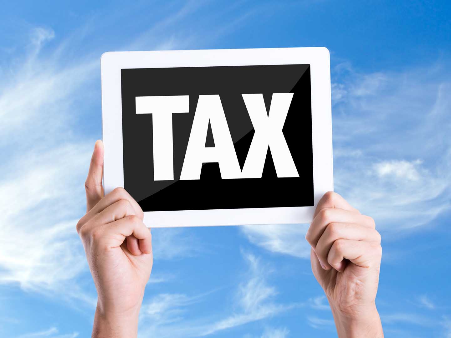 Tablet,Pc,With,Text,Tax,With,Sky,Background